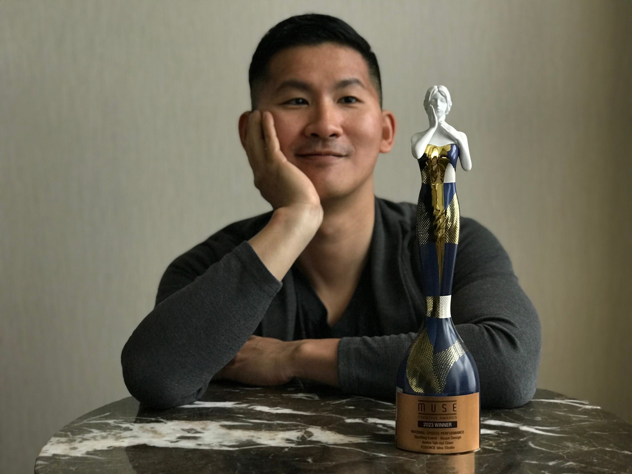 ESSENCE Idea Studio's Andre Teh-Hsi Chen Captivates with Gold Statuette - MUSE Winner Gallery